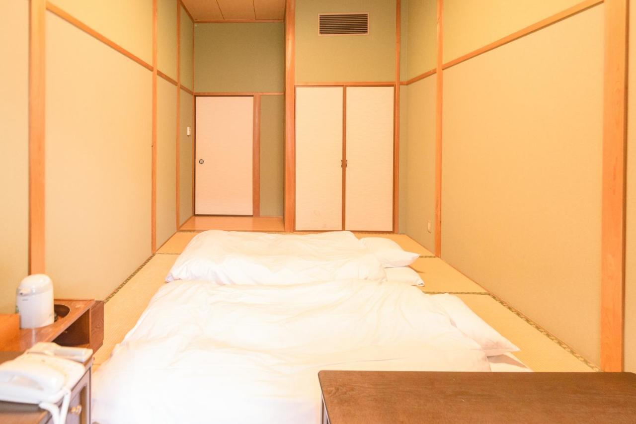 Business Hotel Kawakami كومانو المظهر الخارجي الصورة