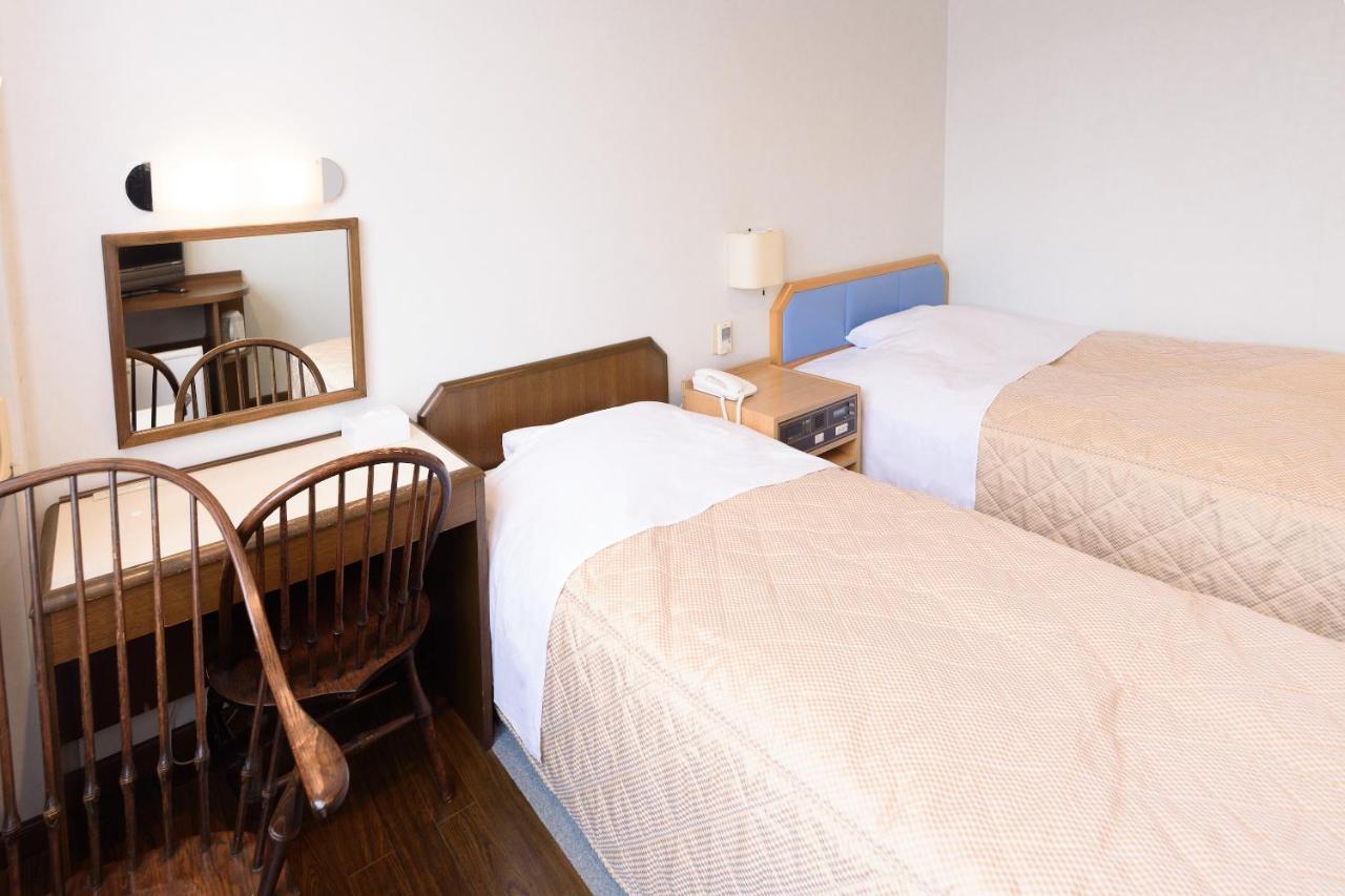 Business Hotel Kawakami كومانو المظهر الخارجي الصورة